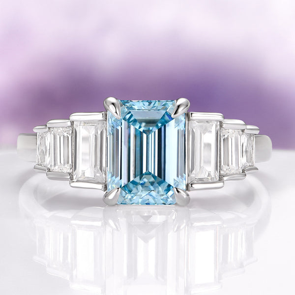 Art Deco Emerald Cut Aquamarine Engagement Ring in Sterling Silver featuring a radiant emerald-cut aquamarine center stone flanked by tapered clear gemstones on a polished sterling silver band by Aquamarise, perfect for Sterling Silver Rings, March Birthstone Jewelry, Engagement Rings for Women, and Meaningful Jewelry Gifts collections.
