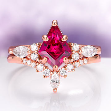 Skye Kite® Lab-Grown Ruby Engagement Ring Set in 14K Solid Rose Gold by Aquamarise Gold, featuring a vibrant kite-cut ruby and marquise-cut white stones on a rose gold band.