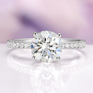 Diamond ring with a clear gemstone on a soft, blurred background