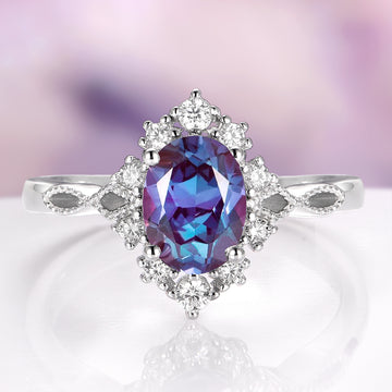 Nesta Alexandrite & Paula Shell Couples Ring Set featuring a vibrant oval alexandrite center set in sterling silver with intricate milgrain detailing and sparkling white diamond accents, part of Aquamarise’s Matching Couples' Rings and June Birthstone Jewelry collections.
