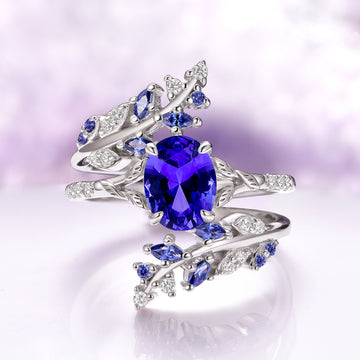 Orion Nebula™ & Cornflower Sapphire Leaf Couples Ring Set by Aquamarise featuring an elegant silver band adorned with a vibrant cornflower sapphire center stone and delicate leaf-inspired accents with small blue sapphires and diamonds, part of Matching Couples' Rings, September Birthstone Jewelry, Leaf Rings, and Orion Nebula Rings® collections.