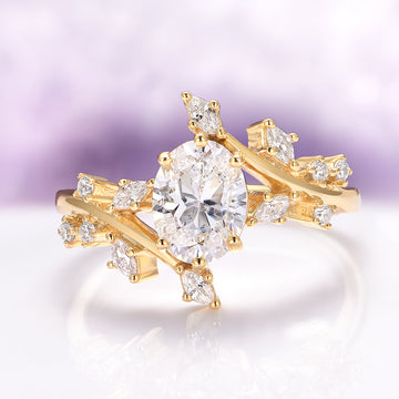 Lab-Grown Diamond Leaf Engagement Ring in 14K Solid Yellow Gold (IGI Certified) featuring an oval center diamond surrounded by delicate leaf-shaped accents set on a nature-inspired band, crafted by Aquamarise Gold.