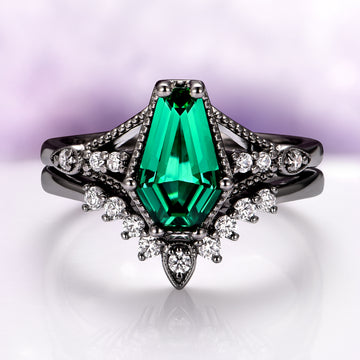 Lilith Coffin Cut Emerald & Green Fire Opal Couples Ring Set by Aquamarise features a striking coffin-shaped emerald gemstone set in black-finished silver, accented with sparkling green fire opals and diamonds, from Matching Couples' Rings and October Birthstone collections.