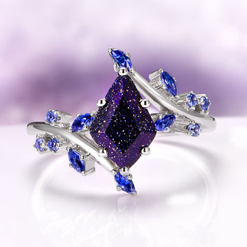 Starry Night and Fire Opal Leaf Couples Ring Set by Aquamarise, featuring a glittering galaxy sandstone centerpiece with a marquise shape, accented with blue marquise and round gemstones on a silver band with delicate leaf motifs.