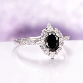 Astra Black Onyx Engagement Ring in Sterling Silver by Aquamarise, featuring an oval black onyx center surrounded by sparkling diamonds on a polished sterling silver band.