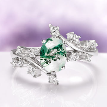 Green Moss Agate Leaf Engagement Ring in 14K White Gold by Aquamarise Gold featuring an oval moss agate center stone with diamond-accented leaf motifs in a nature-inspired design.