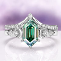 Elara Pacific Green Moissanite & Crescent Moon Engagement Ring Set in 14K White Gold by Aquamarise Gold features a stunning hexagonal green moissanite center stone framed by crescent moon and diamond accents, crafted with celestial elegance.