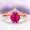 Bella Oval Cut Ruby Engagement Ring Set in 14K Solid Rose Gold by Aquamarise Gold, featuring a vivid oval ruby and sparkling diamond accents for a unique, romantic engagement ring set.