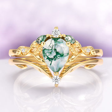Green Moss Agate Leaf Engagement Ring Set in 14K Solid Yellow Gold by Aquamarise Gold, showcasing a pear-shaped green moss agate centerpiece with delicate leaf motifs and diamond accents, part of nature-inspired and non-traditional engagement ring collections.