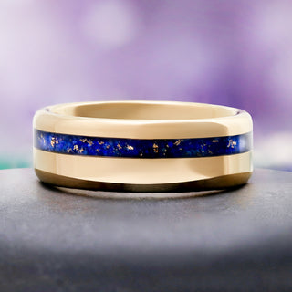 Close-up of the deep blue lapis lazuli inlay on polished yellow gold