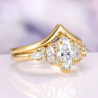 Gold ring with diamond stones on a reflective surface