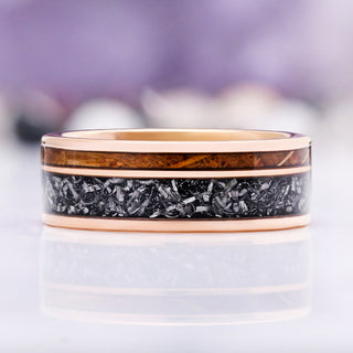 Side profile of the whiskey barrel oak and crushed meteorite channels between rose gold edges