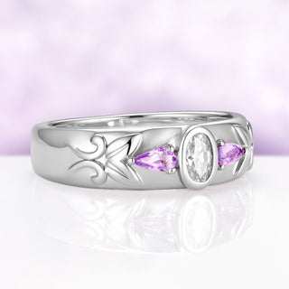 Angled view of the 6mm moissanite and amethyst men's band showing the dome profile and carved leaf and scrollwork along the shoulder