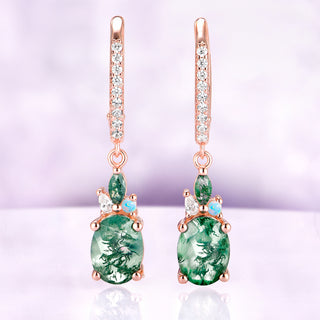 Moss Agate Earrings Natural Moss Agate Drop Earrings over a light purple background