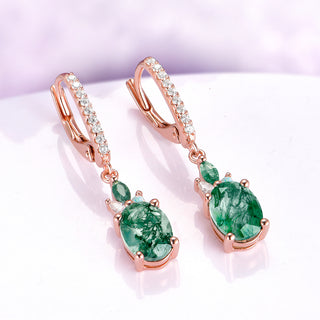 Moss Agate Earrings Natural Moss Agate Drop Earrings over a light purple background
