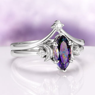 Mystic Moissanite Engagement Ring Celestial Moon Ring over light purple background