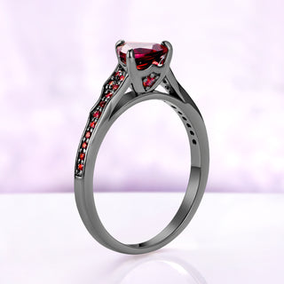 Side profile of the trillion garnet center ring alone, showing the three-prong setting and tapered pavé shank