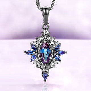 Nightbriar lab-grown alexandrite pendant necklace in black ruthenium, marquise center stone in a milgrain starburst frame on a box chain