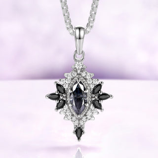 Nightbriar dark gray moissanite pendant necklace in sterling silver with natural black onyx marquise rays on a box chain