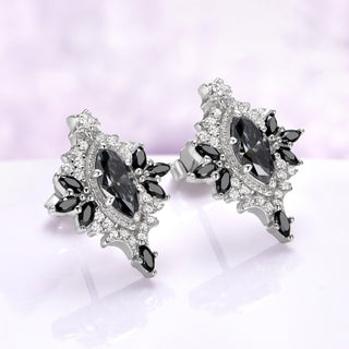 Angled view of the Nightbriar gray moissanite and black onyx stud earrings showing the milgrain frame, cubic zirconia pave and butterfly push-back