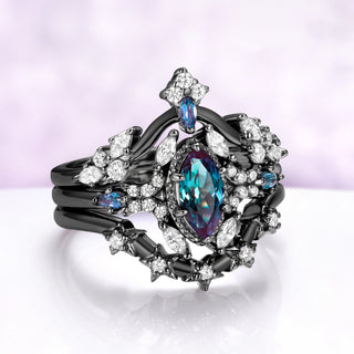Angled view of the full stack, the alexandrite reading teal-blue with violet depths