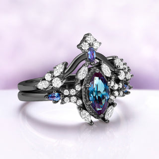 Three-quarter view of the marquise alexandrite in its milgrain frame with shifting side stones