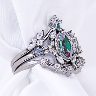 Side view of the three-ring Nightbriar alexandrite set showing how the contour bands nest against the engagement ring