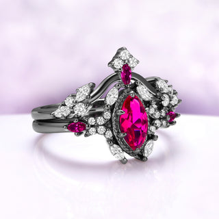 Three-quarter view of the marquise ruby in its milgrain frame with ruby shoulder accents