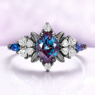 Lab-grown alexandrite engagement ring in black ruthenium showing the teal to violet color shift