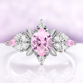 Pink sapphire engagement ring in sterling silver with fantasy cut center and leaf frame