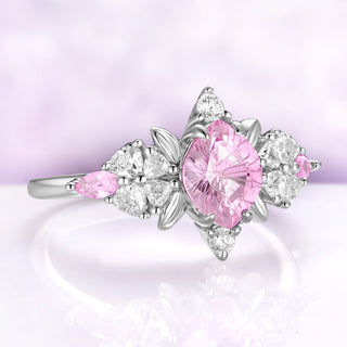 Angled view of the polished silver leaf frame, heart cut blossoms and marquise pink sapphire sides