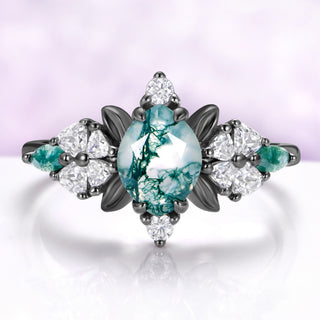 Marquise moss agate engagement ring in black ruthenium with leaf and heart cut accents