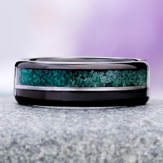 Off-set moss agate and black onyx men's wedding band in polished tungsten carbide, 8mm, showing the crushed green channel, silver rail and black onyx channel