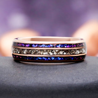 Orion Nebula Crushed Diamond Wedding Band in Tungsten (6mm) by Aquamarise, with a violet and blue crushed inlay between rose gold edges.