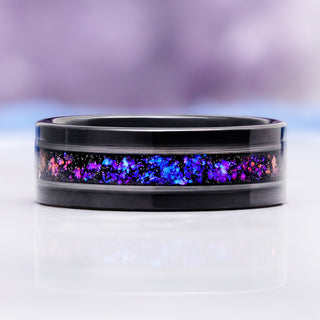 Side profile of the nebula opal inlay glowing against the brushed black tungsten band