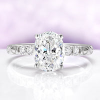 Oval Lab-Grown Diamond Filigree Engagement Ring in 14K White Gold (IGI Certified) by Aquamarise Gold, featuring a vintage-inspired filigree band with round side diamonds and an oval-cut center stone.