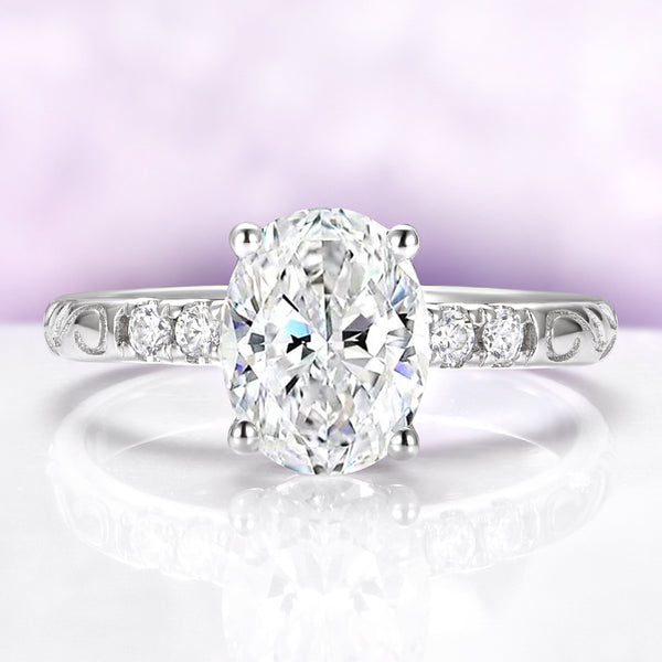 Oval Lab-Grown Diamond Filigree Engagement Ring in 14K White Gold (IGI Certified) by Aquamarise Gold, featuring a vintage-inspired filigree band with round side diamonds and an oval-cut center stone.