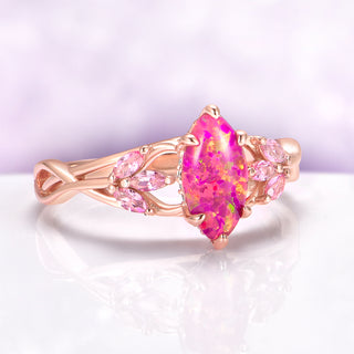 Pink Fire Opal & Sapphire Celtic Knot Ring in 14K Rose Gold Vermeil by Aquamarise, featuring a vibrant pink fire opal marquise center with sapphire accents in an intricate rose gold knot design.