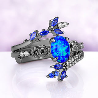 Angled view of the Rosalind opal set showing the lab-created blue sapphire marquise clusters and simulated diamond pavé