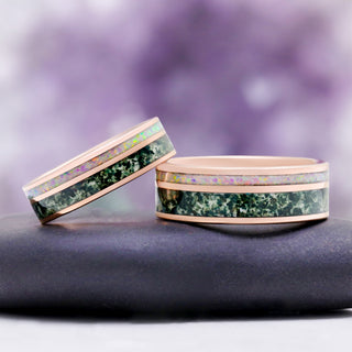 Rose Gold Tungsten Moss Agate & Fire Opal Couples Ring Set by Aquamarise, two rose gold bands inlaid with green moss agate and white fire opal.