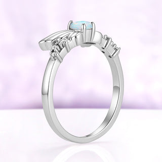 Side profile of the silver Selene wing ring, showing how the wings rise from the slim band