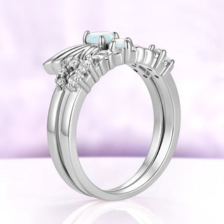 Side profile of the silver Selene crescent moon band stacked beneath the Selene wing ring, sold separately