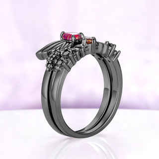 Side profile of the Selene moon band stacked beneath the Selene wing ring, sold separately, in black ruthenium