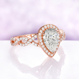 Simulated Diamond Engagement Ring in 14K Rose Gold Vermeil by Aquamarise, angled view of the pear-cut halo and twisted pave shoulders.