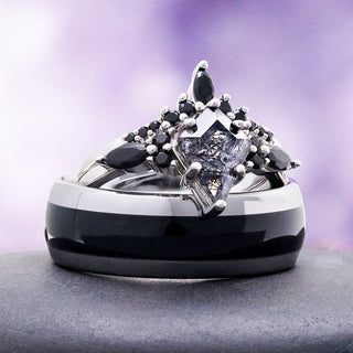 Kite cut rutilated quartz ring with black onyx accents stacked on the black and silver band
