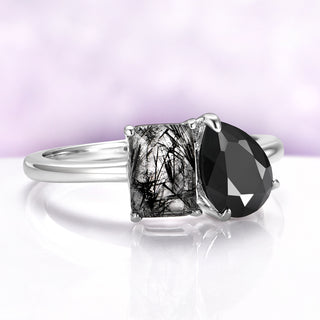 Toi Et Moi Rutilated Quartz & Black Onyx Engagement Ring in 14K White Gold, featuring a natural emerald-cut rutilated quartz and pear-shaped black onyx in a delicate solid gold band.