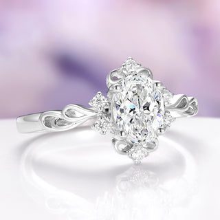 Silver ring with an oval-shaped diamond on a light purple background