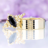 Viridian black onyx couples ring set in 14K yellow gold vermeil: her marquise onyx leaf and crescent moon ring beside his 8mm carved leaf band with channel-set onyx