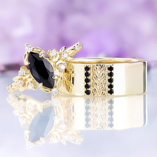 The 8mm Viridian leaf and black onyx band in gold vermeil shown with the matching women's marquise ring as a couples ring set