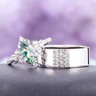 The 8mm Viridian leaf and green tourmaline band shown with the matching women's marquise ring as a couples ring set